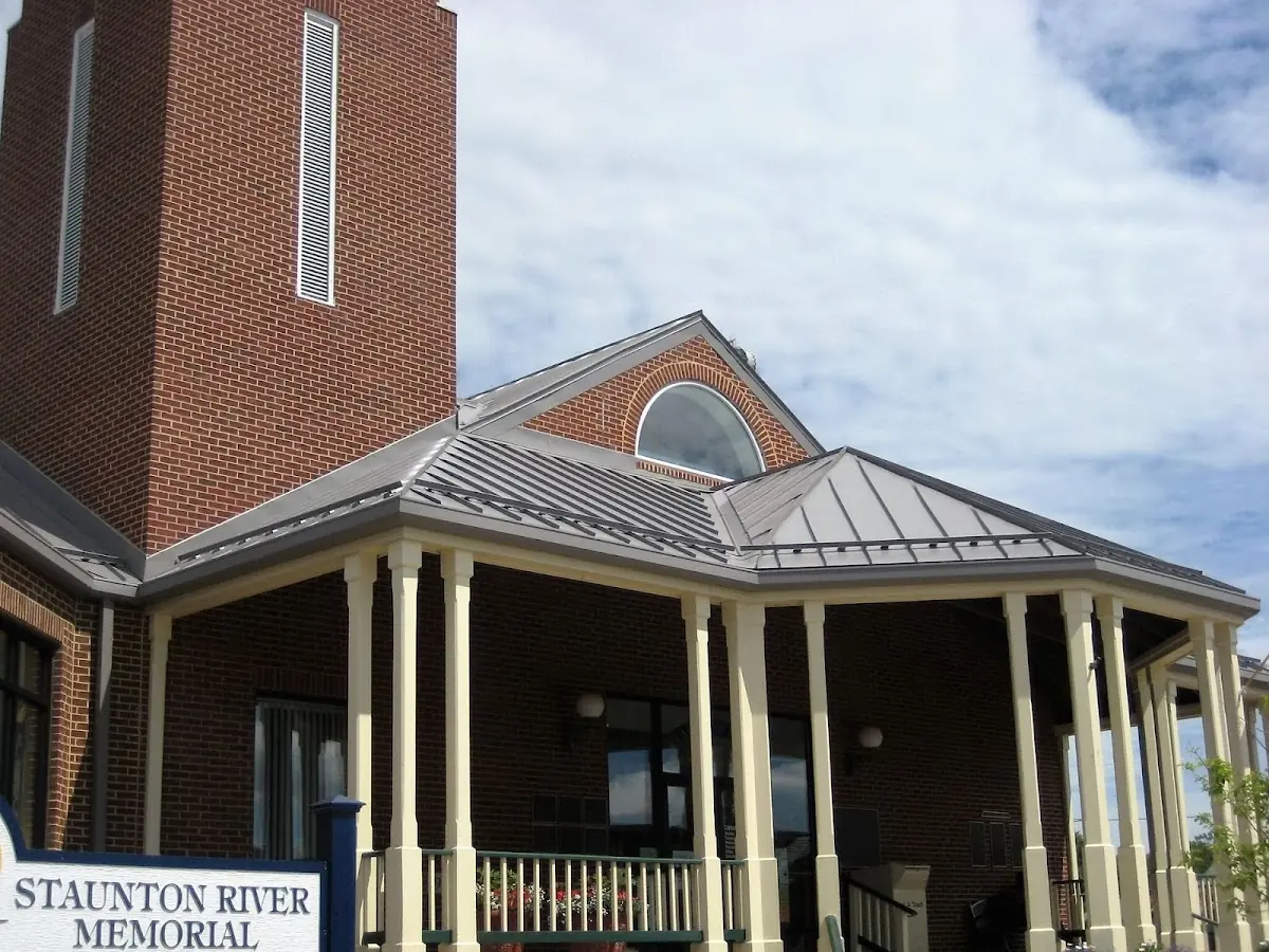 Skilled roofing craftsmen working on a residential roof in Hanover Center